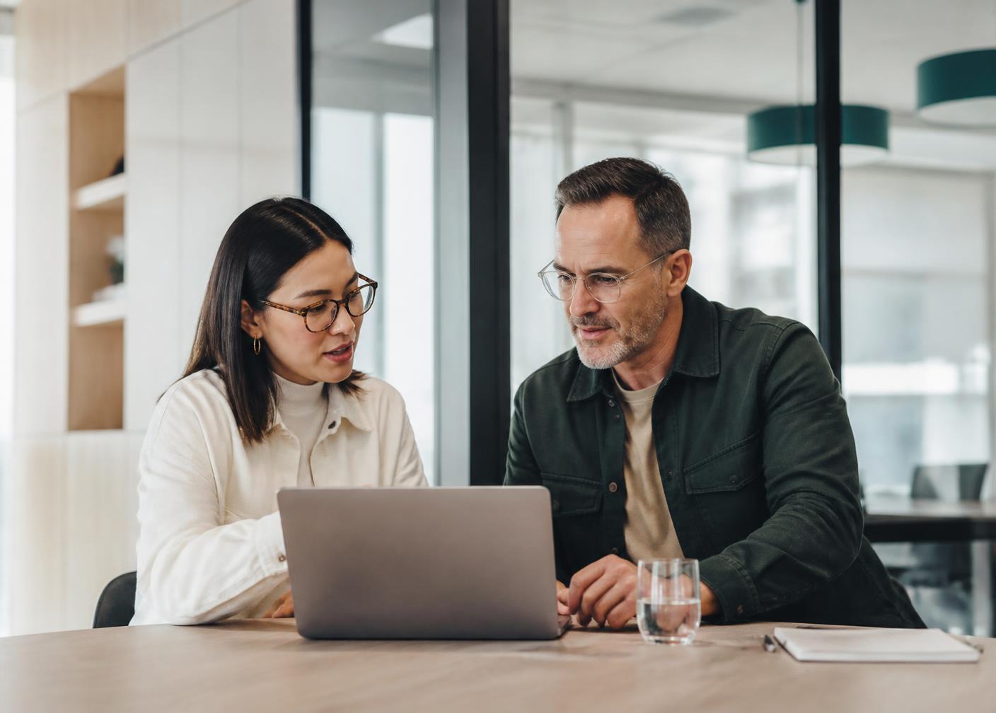 Recruiters reviewing candidate profiles together